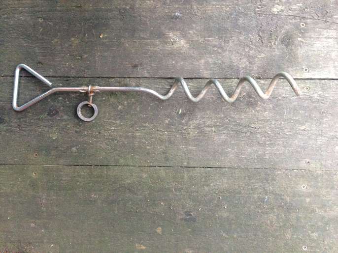 FreelyWheely Strong screw in ground anchor for attaching dog lead.