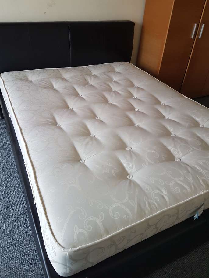 FreelyWheely Double bed and mattress with storage area