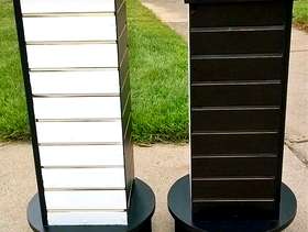 Freecycle Two swivel slotted display stands.