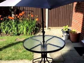 Freecycle Glass topped table with parasol