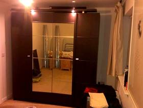 Freecycle Wardrobe with lights and mirrored doors.