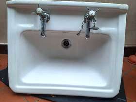 Freecycle White bathroom sink and separate stand.