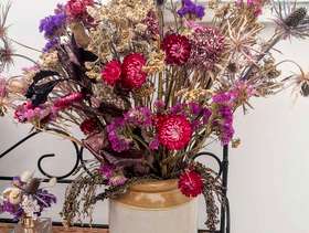 Freecycle A vintage stoneware jar filled with dried flowers