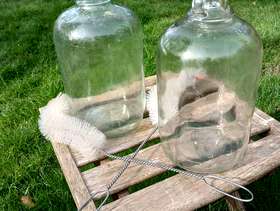 Freecycle Glass Demijohns clear and brown.
