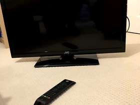 Freecycle Flat screen TV with remote and table/stand.