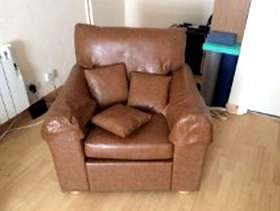 Freecycle Armchair, brown faux leather.
