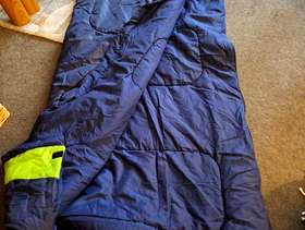 Freecycle Navy sleeping bag with green stripes .
