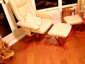 Freecycle Cream leather reclining chairs with matching footstools.