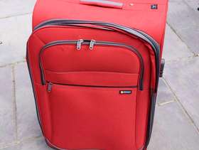 Freecycle Large red suitcase 75cm tall by 47cm wide.