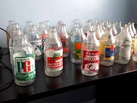 Freecycle Old glass milk bottled with coloured transfers