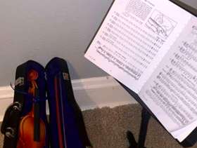 Freecycle Gently used American girl doll violin, stand, and music book