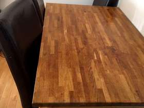 Freecycle Dining table with four brown leather chairs,