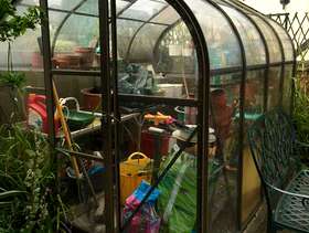 Freecycle Metal framed greenhouse.